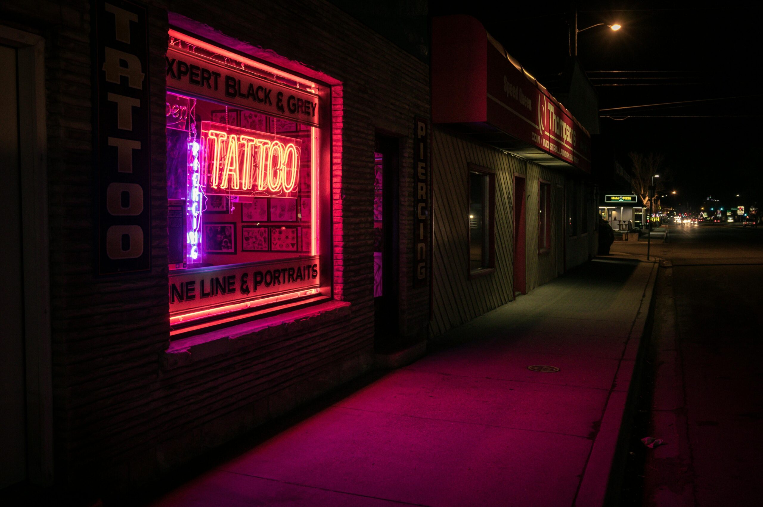 A vibrant gaming tattoo featuring glowing neon colors