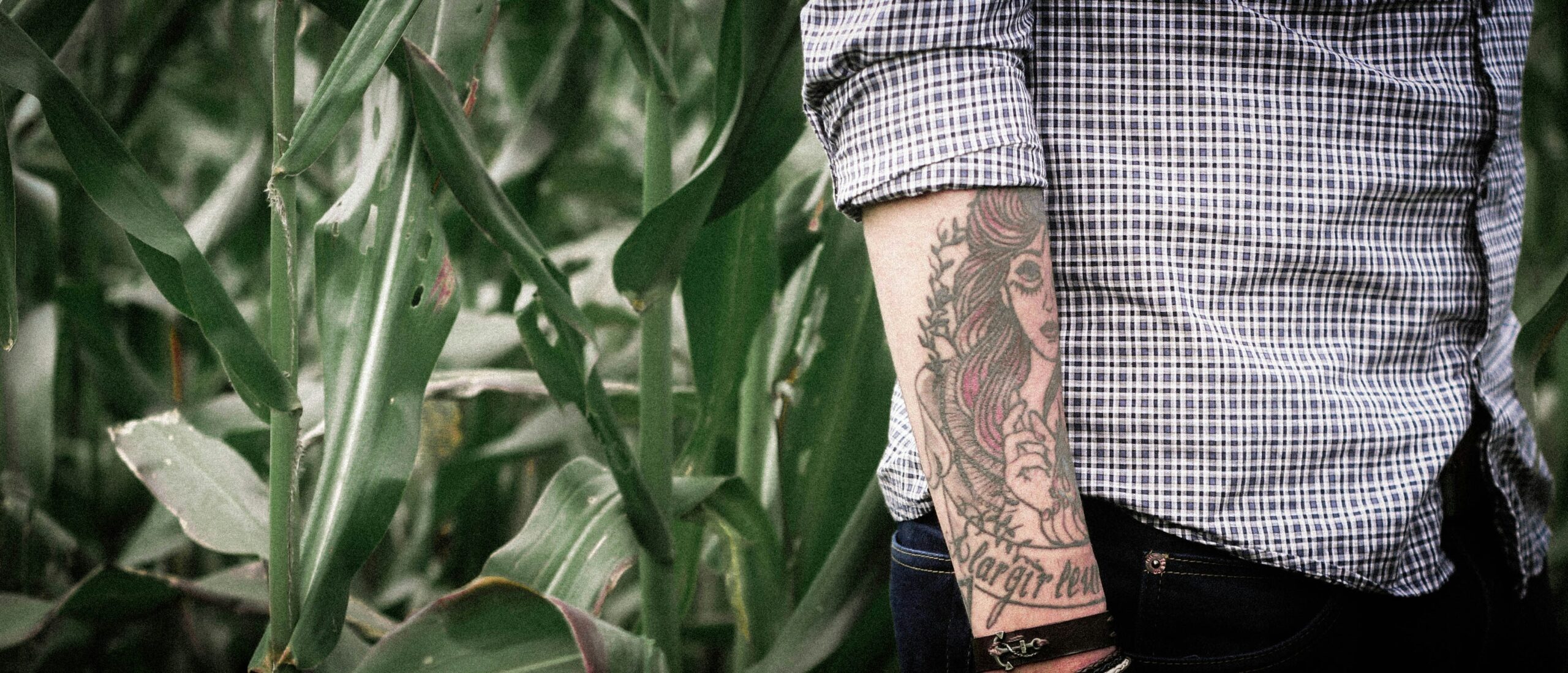 Photo of Alex wearing his completed Zelda-themed tattoo sleeve