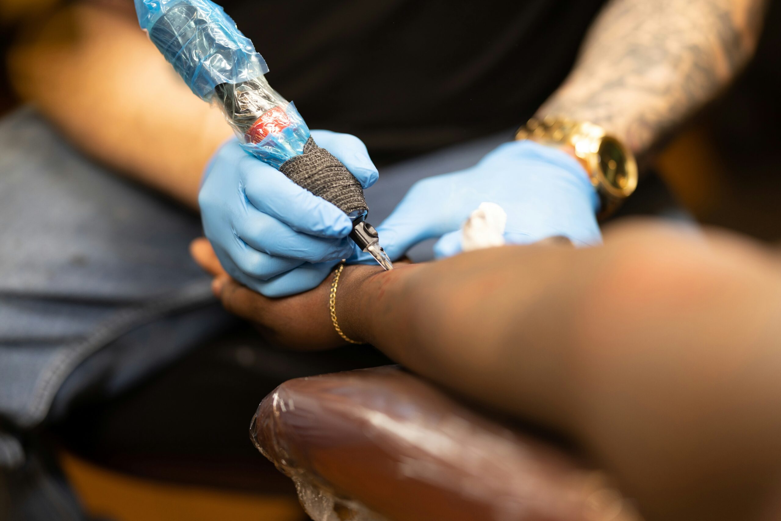 Photo of tattoo aftercare products like ointments and cleaning wipes