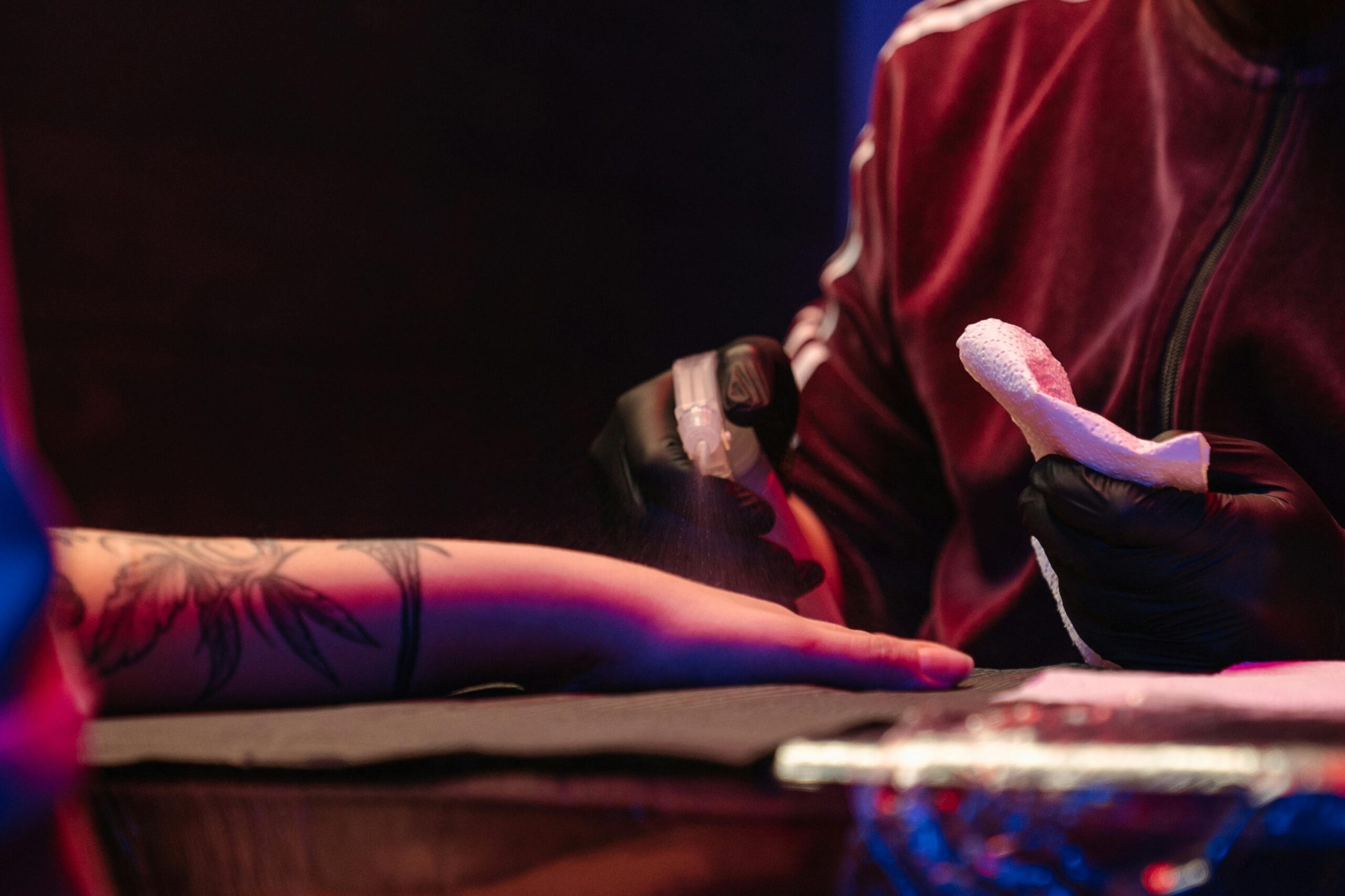 Steps illustrating proper tattoo cleaning process with recommended items
