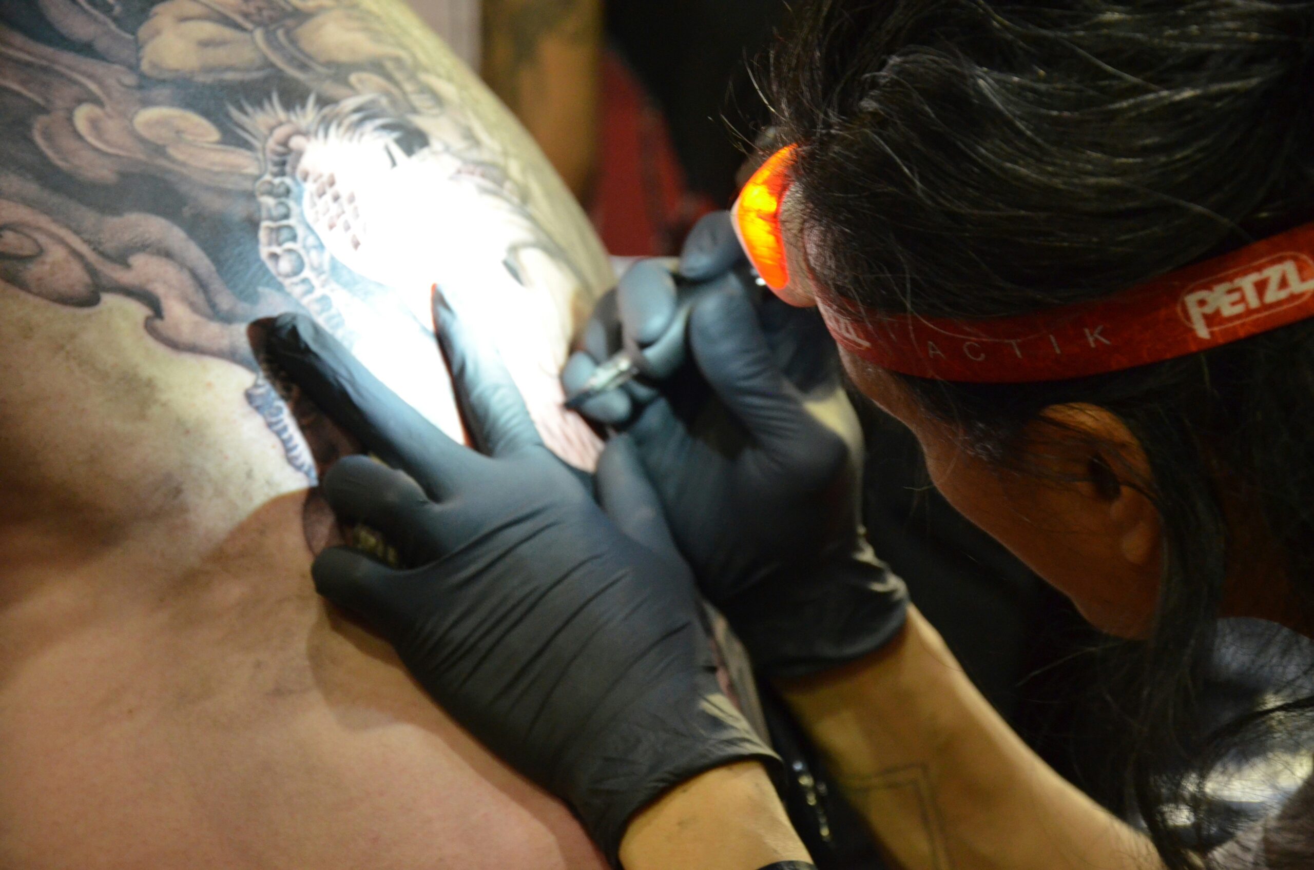 Tattoo showcasing Kazuya Mishima with glowing cybernetic details