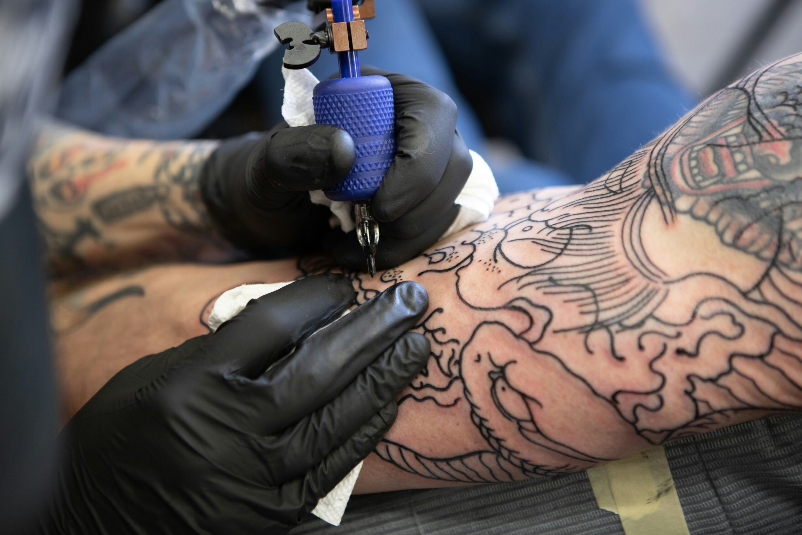 An image showing faded gaming tattoo compared to well-cared one