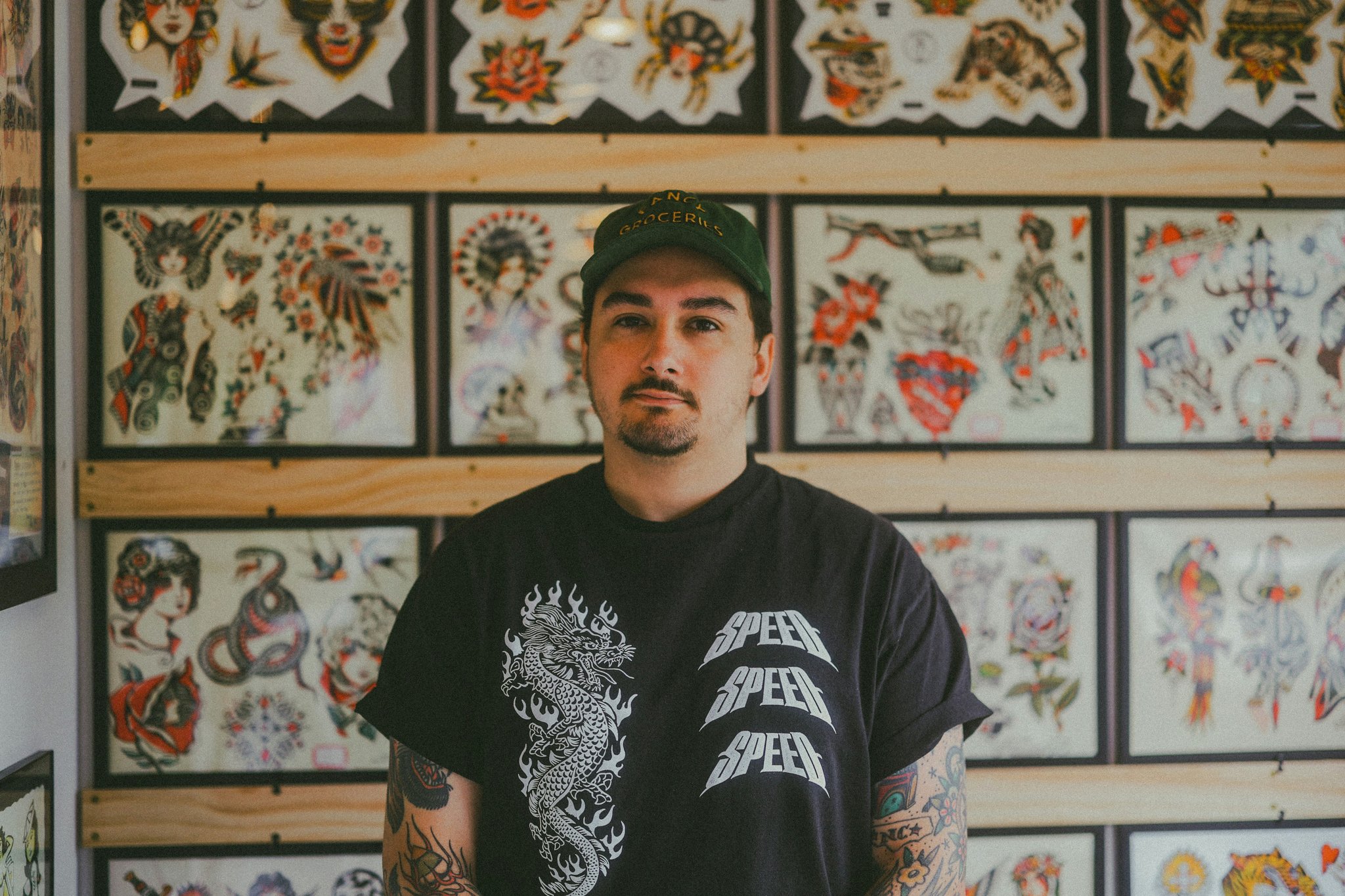 Photo collage of real-life gaming tattoos including Breath of the Wild and Halo themes