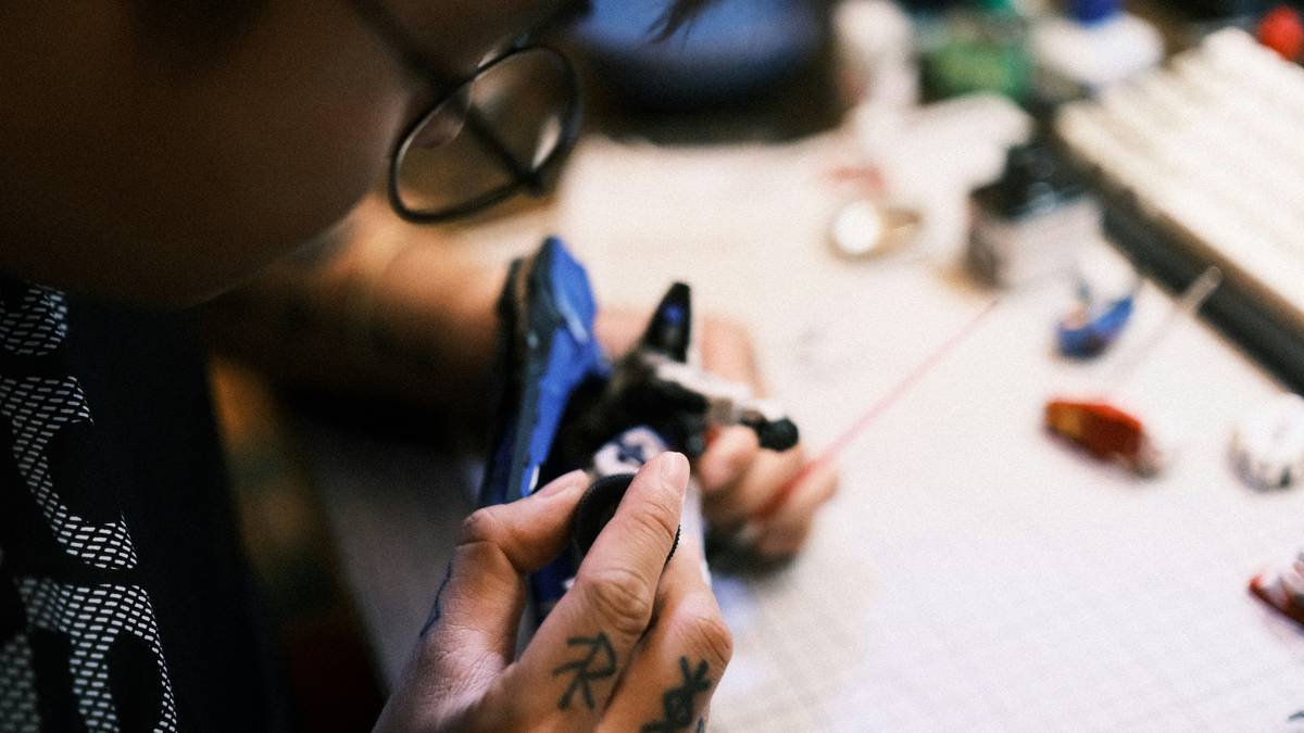 A fantasy-style RPG tattoo featuring a dragon wrapped around a sword