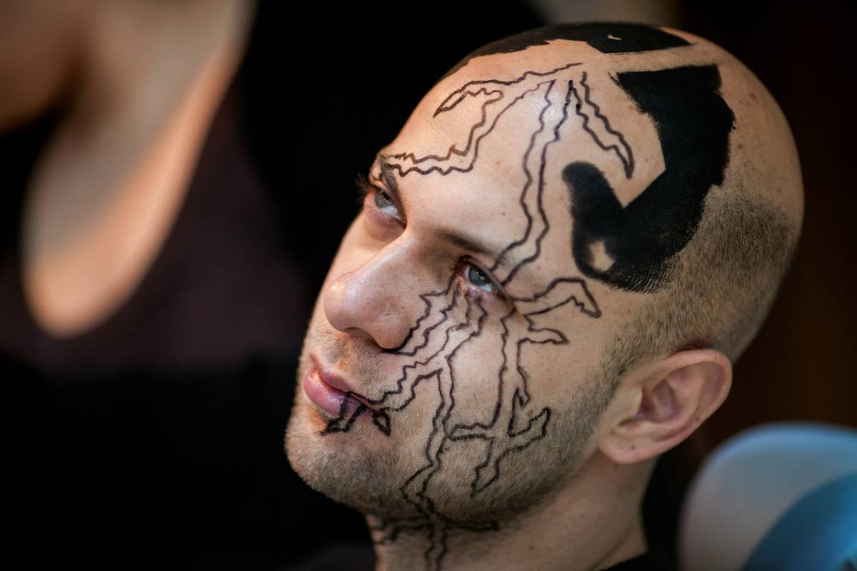 A minimalist pixelated mushroom tattoo inspired by classic video games.