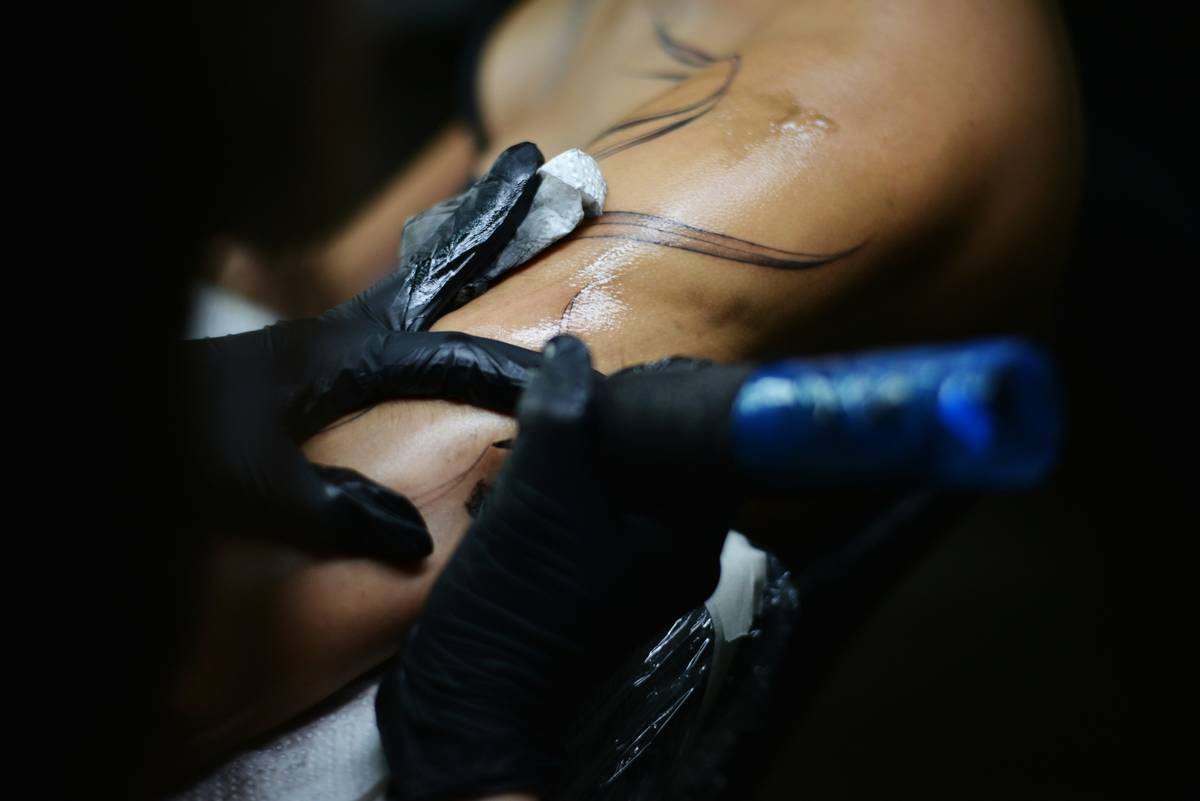 Two images comparing poorly cared-for vs properly maintained gaming tattoos.