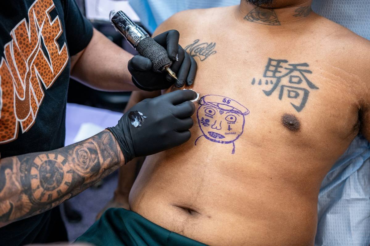 A stunning example of a Chicano-style gaming tattoo featuring Mario with detailed line work.