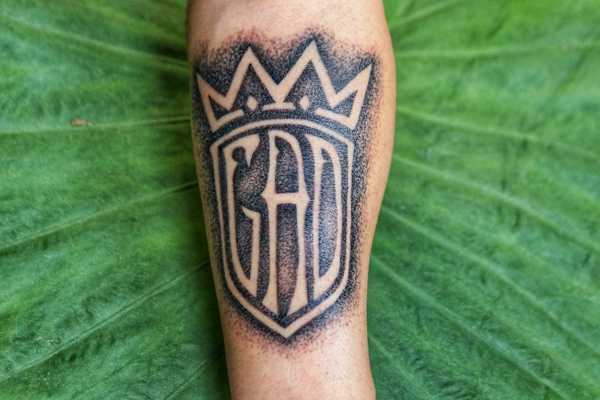 Infographic breaking down core cyberpunk tattoo symbols: neon grids (surveillance), biomech hearts (body autonomy), broken circuitry (system failure), kanji fragments (lost identity)