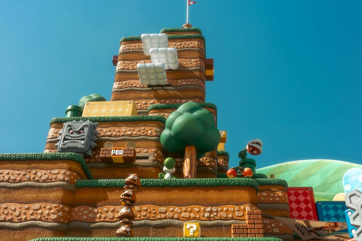 A colorful super mario themed castle with characters
