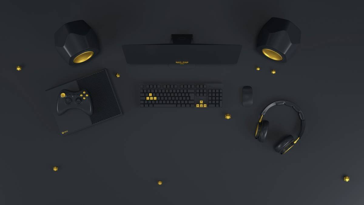a computer desk with a keyboard, mouse and headphones