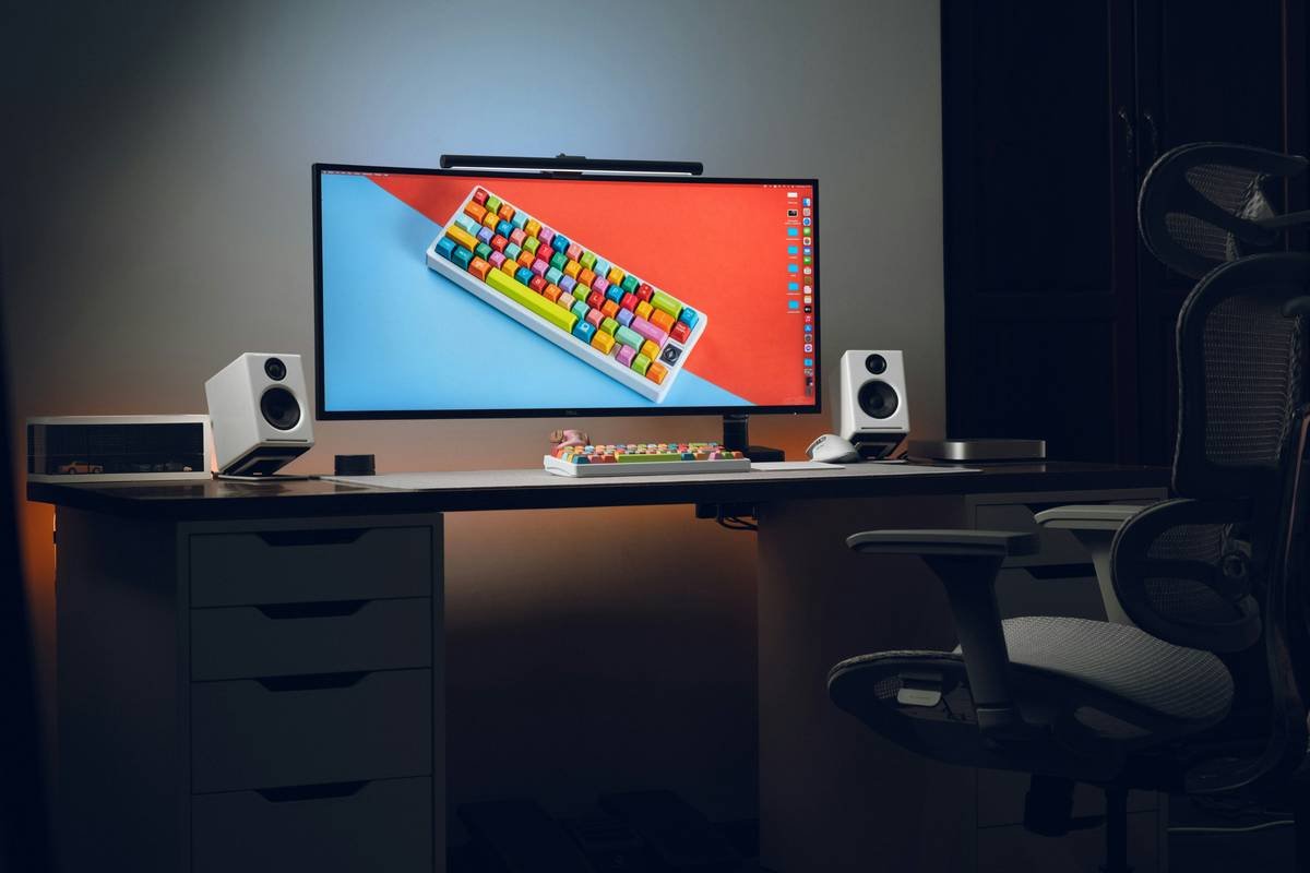 A computer monitor sitting on top of a desk