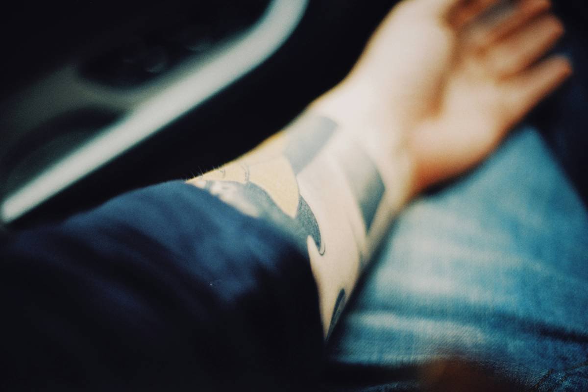 a person with a tattoo on their arm