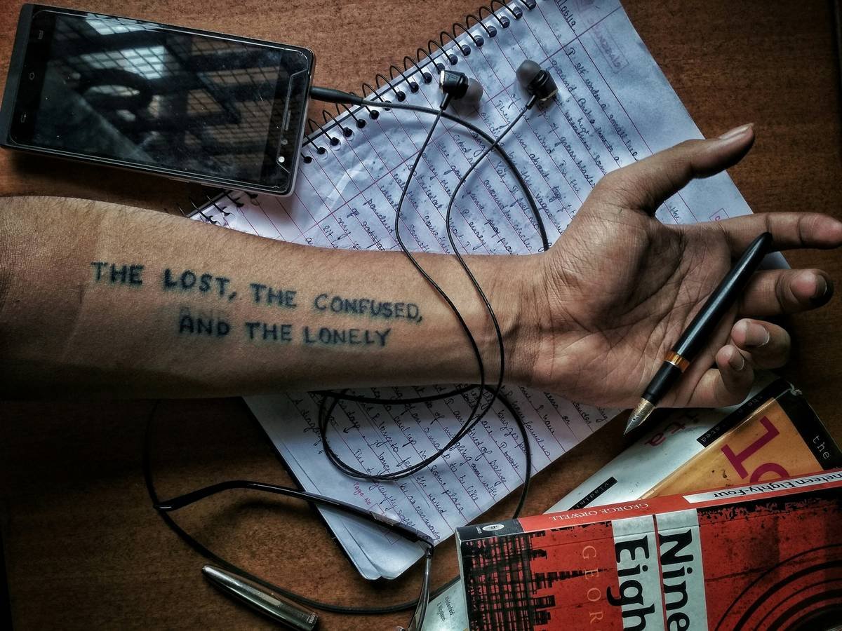 man holding black pen