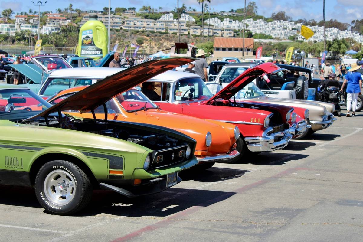 Row of classic cars at an outdoor event
