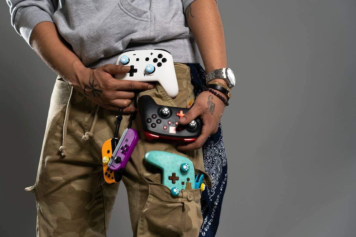 a man is holding a video game controller