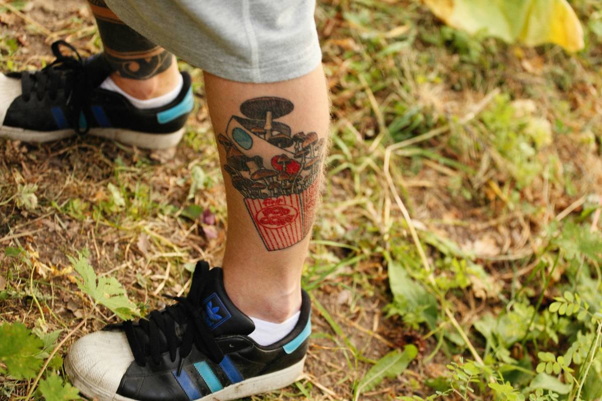 a person with a tattoo on their leg