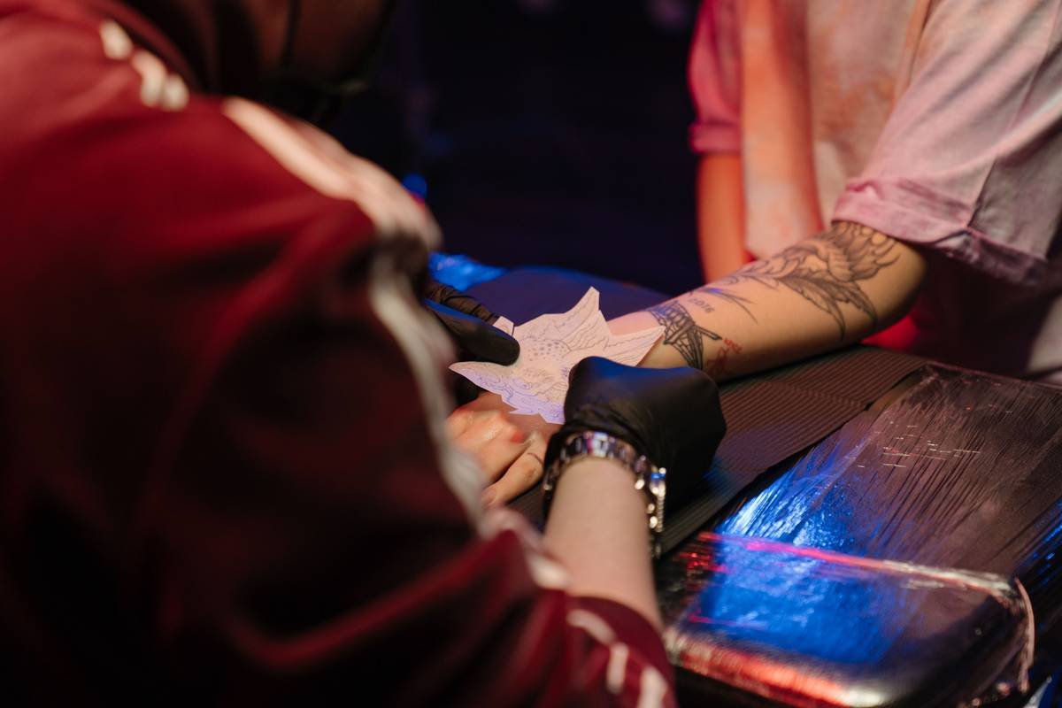Bar chart showing rise in 'gaming tattoo' Google searches from 2019–2024, with 'dungeon tattoo' spiking 210% in 2023