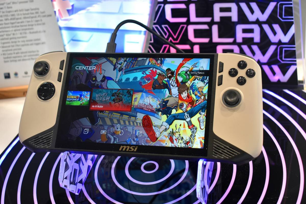 Handheld gaming device with colorful game display.